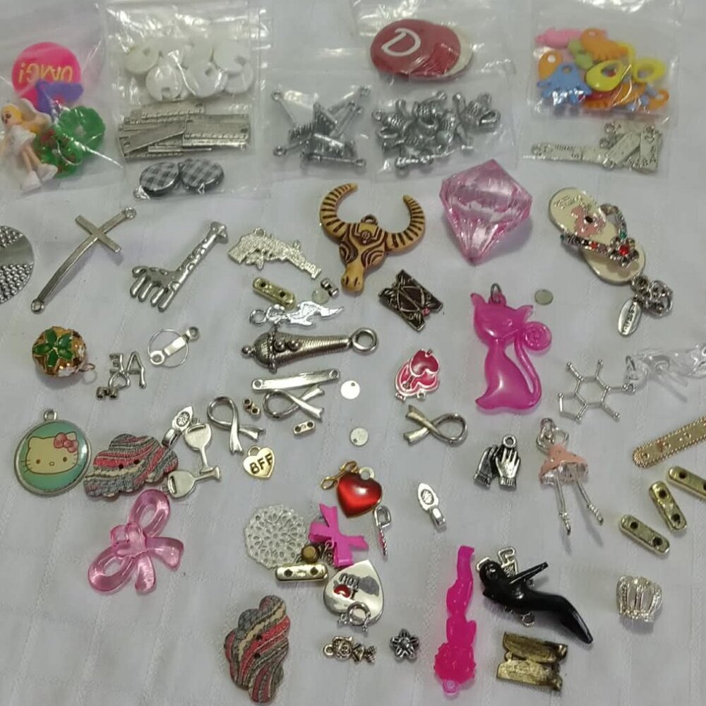Nearly a hundred charms of various eras, sizes and materials for DIY projects